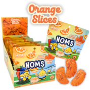 Photo of Noms Orange Slices Case of 10 Pouches showing gummies shaped as orange slices covered in li hing powder and lemon peel.